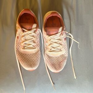 Under Armour Charged Impulse size 9, pink and white in color.